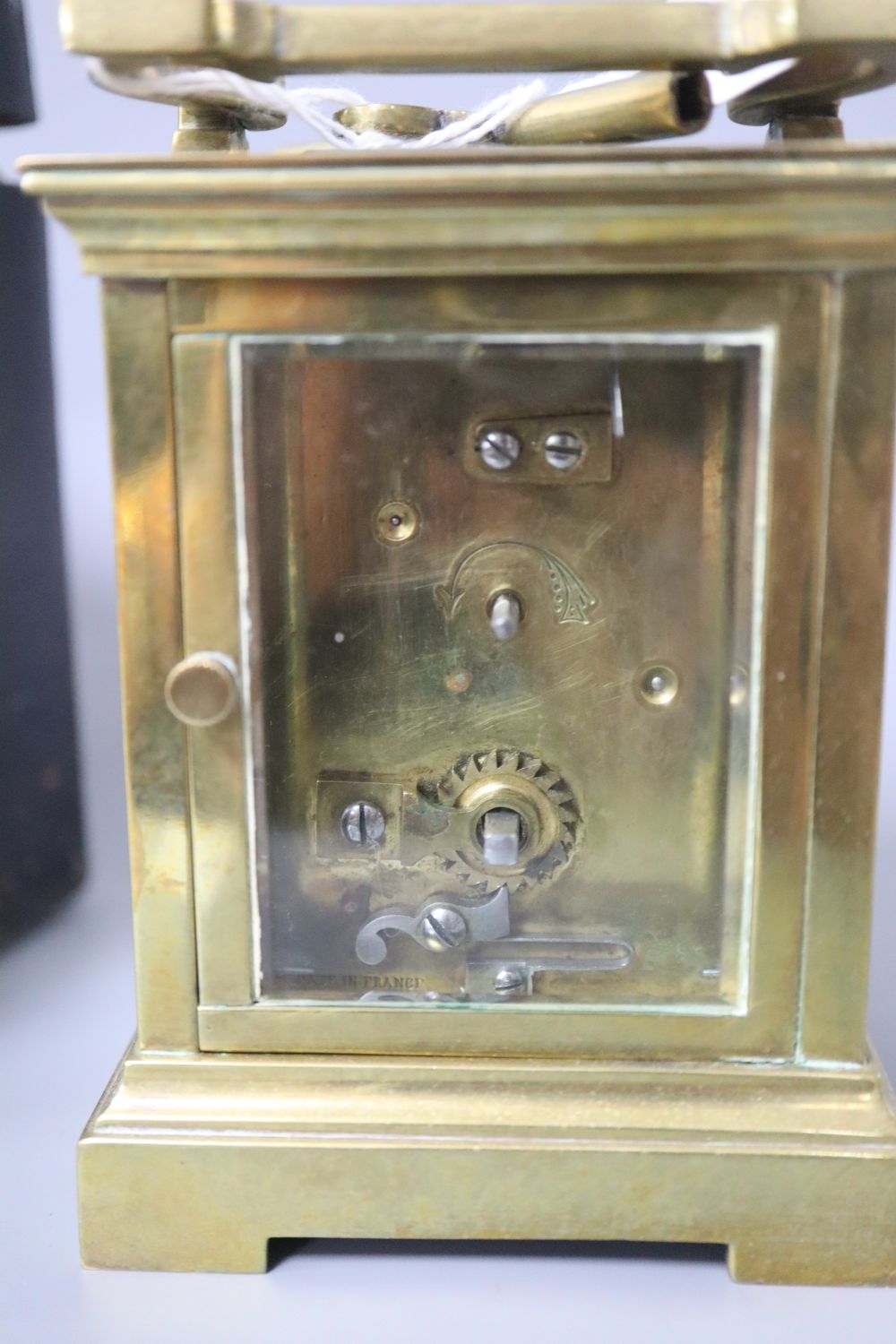 A French brass carriage timepiece with outer carrying case